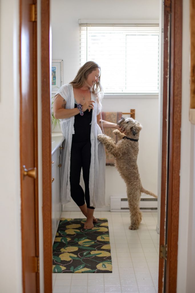 Livia indoors with dog